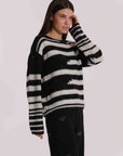 -  Maglione mimi
Fantasia a righe con dettaglio in paillettes  -  AFAN-3758